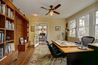 Dedicated workspace integrated into the home with natural light and built-in storage.